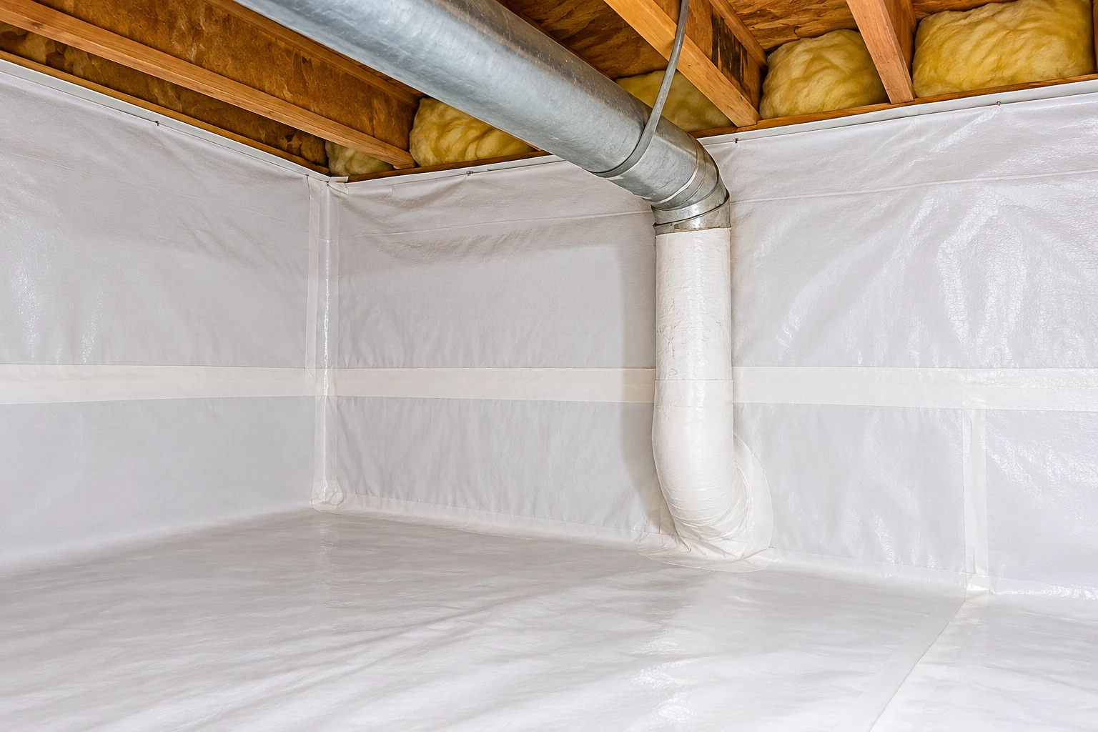 White vapor barrier sheeting covers a crawl space floor and walls beneath exposed joists, insulation, and a large duct.
